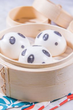 closeup of panda steamed buns, dim sum