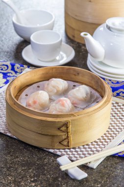 closeup of dim sum in  bamboo steamer 