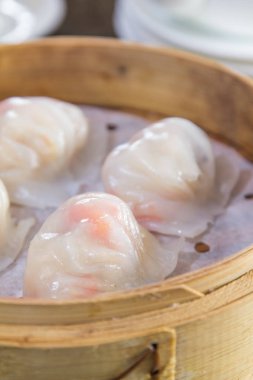 closeup of dim sum in  bamboo steamer 