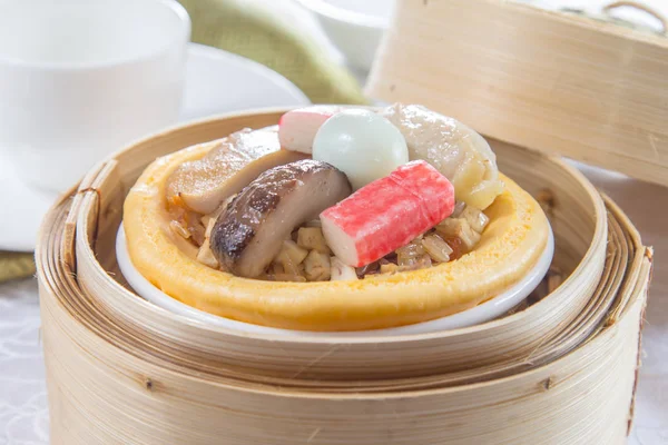 closeup of dim sum in  bamboo steamer 