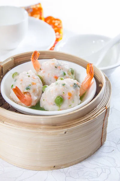 closeup of dim sum in  bamboo steamer 