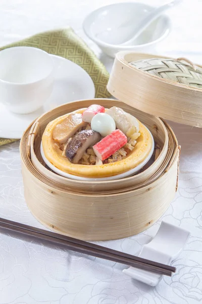 closeup of dim sum in  bamboo steamer 