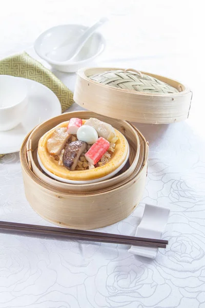 closeup of dim sum in  bamboo steamer 