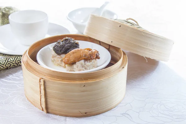 closeup of dim sum in  bamboo steamer 