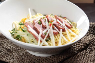  plate of noodles on table, closeup