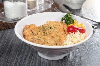 close up of plate of noodles on table  