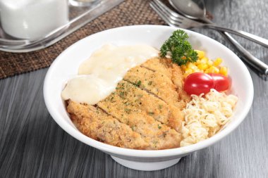 close up of plate of noodles on table  