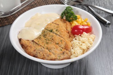 close up of plate of noodles on table  