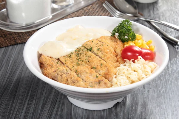 close up of plate of noodles on table  