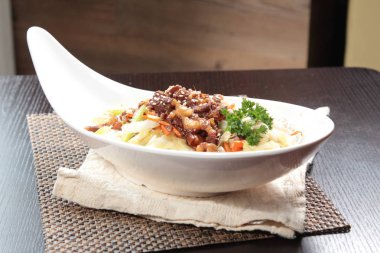 close up of plate of noodles on table  