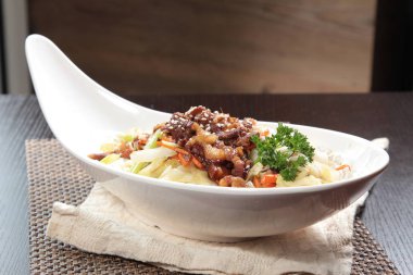 close up of plate of noodles on table  