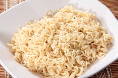 close up of plate of noodles on table  
