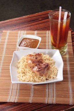close up of plate of noodles on table  