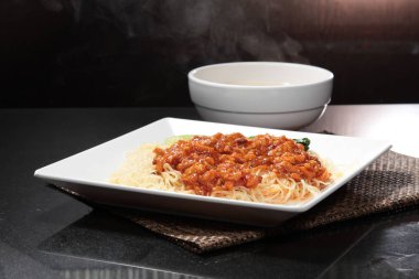  plate of noodles on table, closeup
