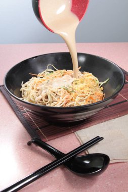 plate of noodles on table, closeup
