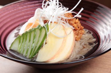  plate of noodles on table, closeup