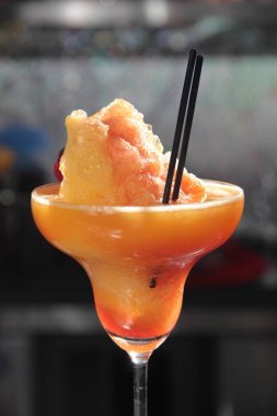 close up of delicious red cocktail drink on table, closeup