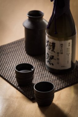 Image of warm sake  on a wooden table