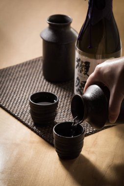 Image of warm sake  on a wooden table