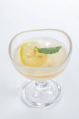 green tea in the glass on a white background