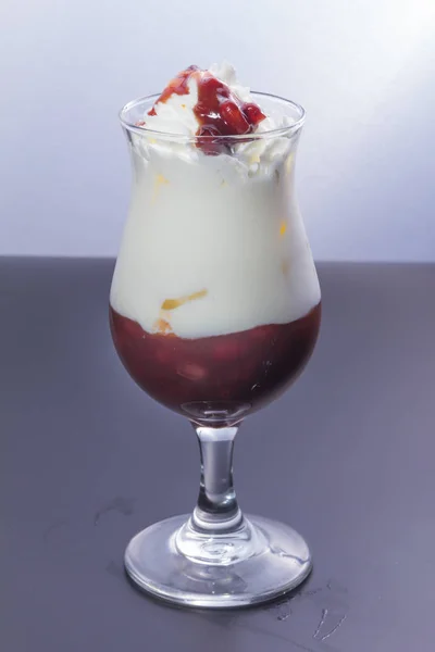 Glass Tasty Yogurt Whipped Cream Fresh Berries White Background — Stock fotografie