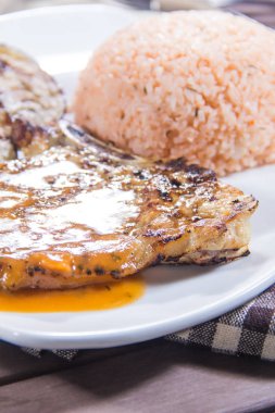 grilled meat and rice on plate