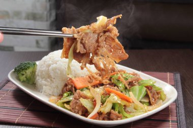 stir fried pork with kimchi and black rice-thai food style