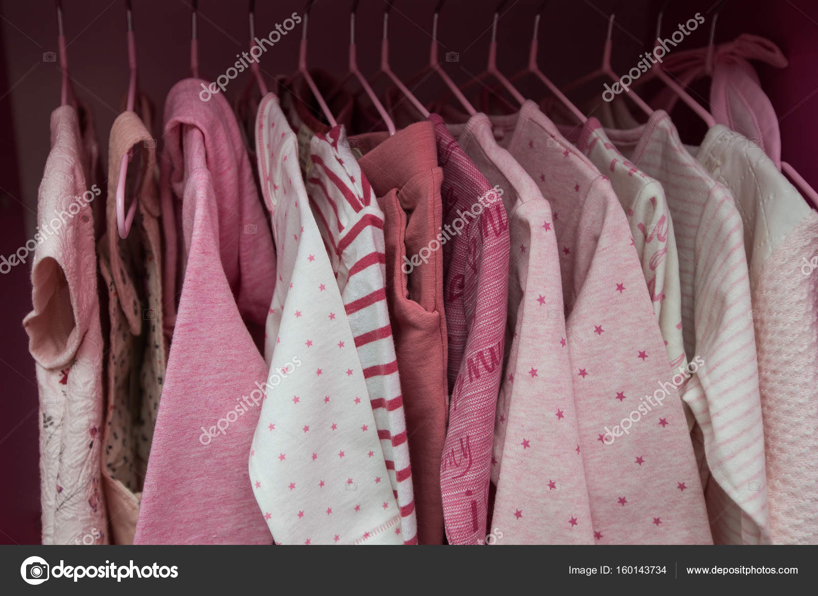 A Lot Of White Childrens Clothes On Hangers Childrens Wardrobe