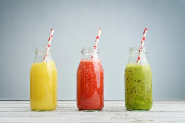 Fruit smoothies in retro bottles — Stock Photo, Image