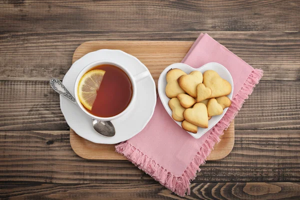 Cup of tea with lemon and cookies — Stock Photo, Image