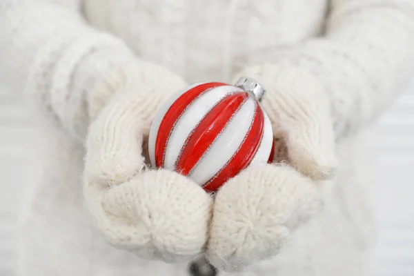 Red christmas ball in female hand closeup — Stock Photo, Image