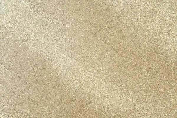 Texturierten nassen Sand Hintergrund — Stockfoto