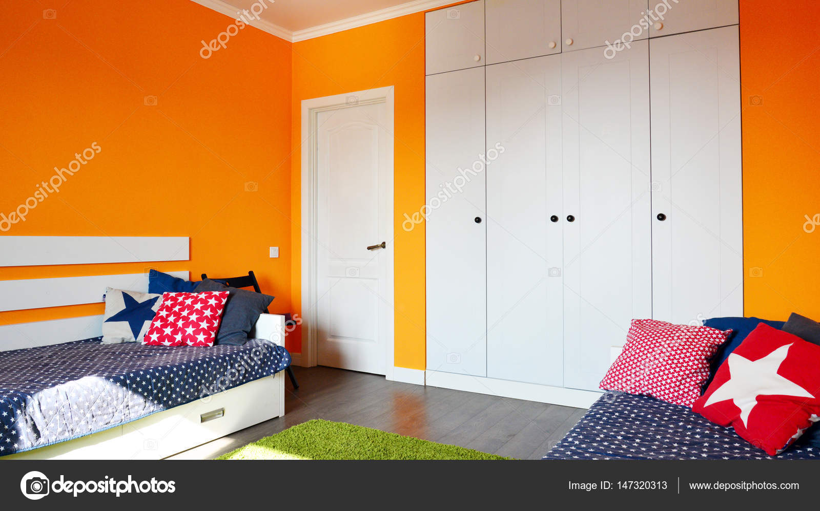 Kids Bedroom In Orange And Blue Colors Stock Photo