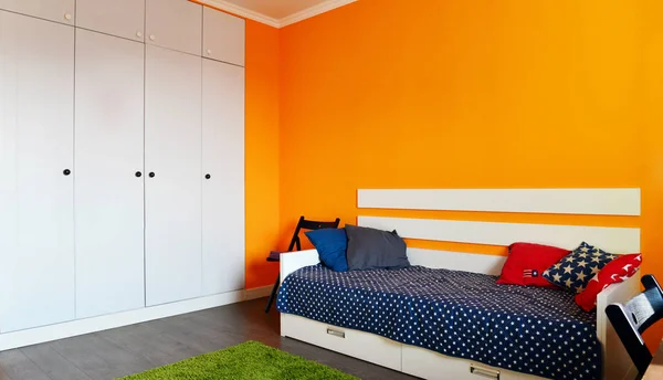 Kids bedroom in orange and blue colors — Stock Photo, Image