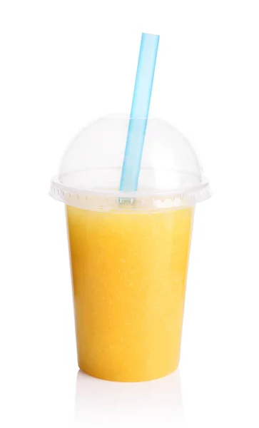 Yellow smoothie in plastic transparent cup — Stock Photo, Image