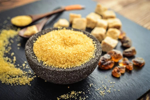 Brown cane sugar in bowl — Stock Photo, Image