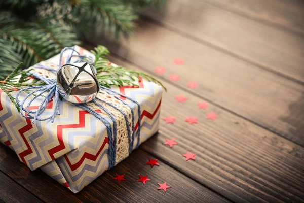 Christmas gift with fir tree twig — Stock Photo, Image