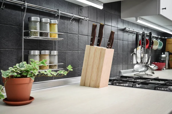 Kitchen utensils and jars of spices