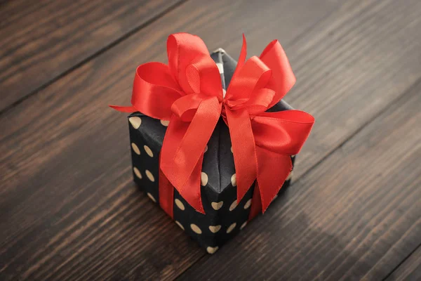 Polka Dot Gift Box Red Ribbon Wooden Background Closeup — Stock Photo, Image