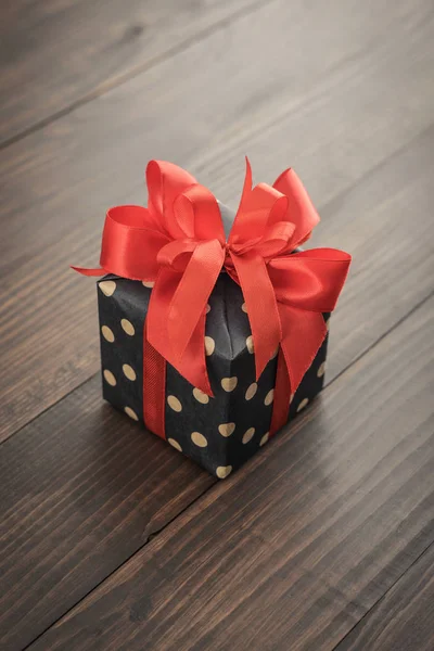 Polka Dot Gift Box Red Ribbon Wooden Background Closeup — Stock Photo, Image