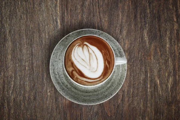 Una Taza Café Con Arte Latte Parte Superior Mesa Madera —  Fotos de Stock