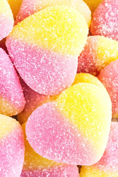 Background of yellow and pink fruit candy in shape of heart, clo — Stock Photo, Image