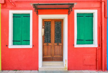 Picturesque windows with shutters of red house on the famous isl clipart
