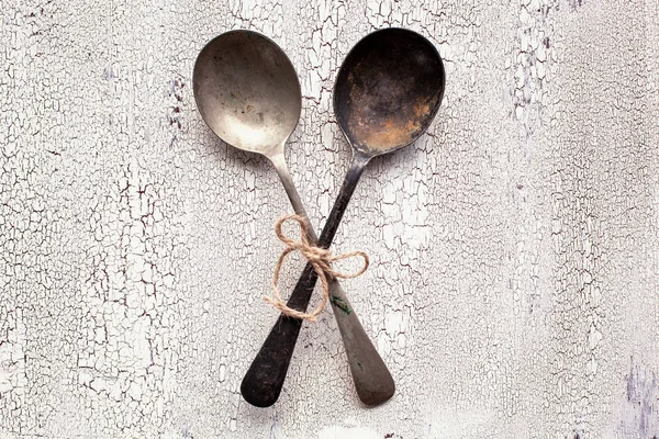 Old vintage spoons on white wooden background — Stock Photo, Image