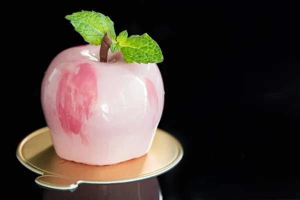 Trendy pink mirror glazed mousse cake in shape of apple on dark — Stock Photo, Image