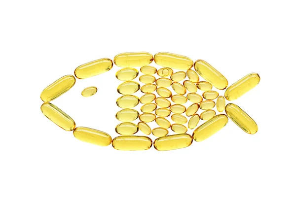 透明的黄色医疗胶囊 鱼的形状 隔离在白色的背景 保健和护理概念 — 图库照片
