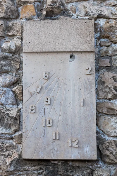 Old sundial on the stone wall — Stock Photo, Image