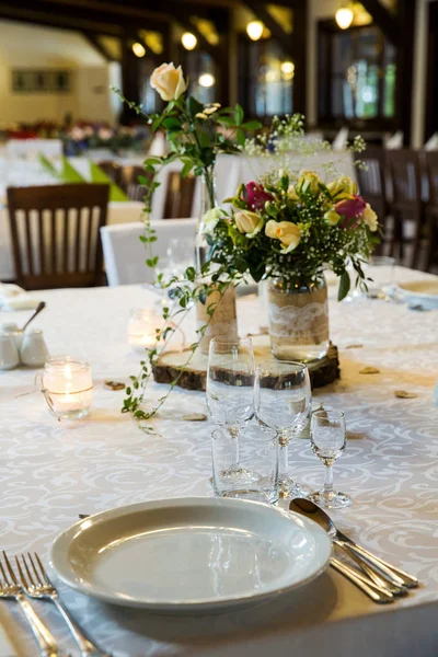 A beautifully decorated and covered table prepared for guests