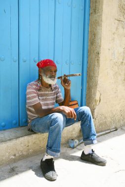 old cuban icon man smoking cigar clipart