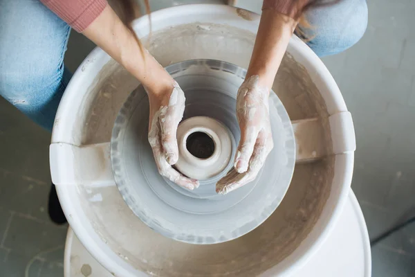 Handcrafted on a potter's wheel,Hands make clay from various items for home and sale in the store and at the exhibition, ceramic items are made in hand, the clay billet becomes a ceramic dish